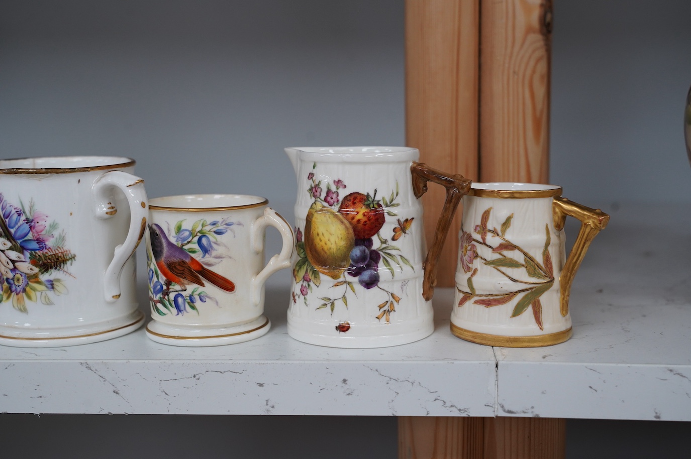 A group of Royal Worcester to include three jugs, two mugs, and two pots, etc. (8). Condition - some damage